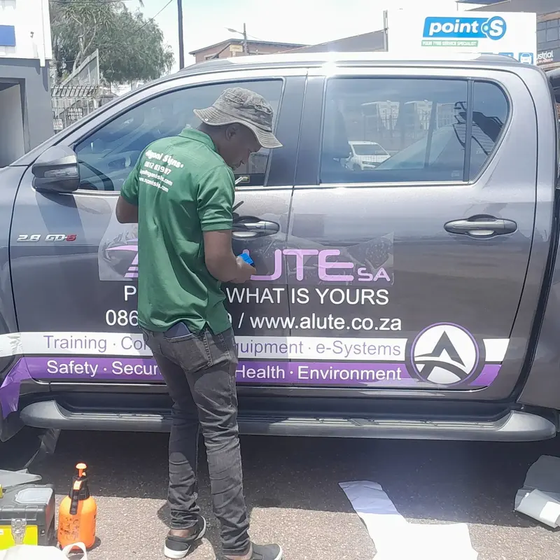Professional double-cab vehicle branding featuring promotional graphics, logos and custom vinyl lettering for effective mobile advertising.