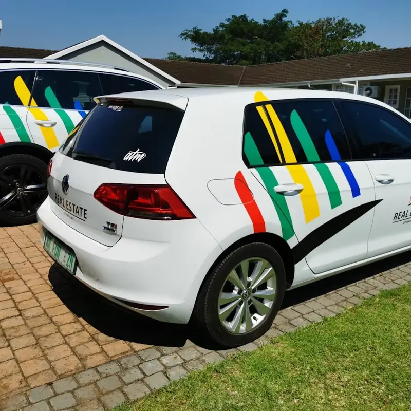 Custom partial vehicle wrap using vibrant multicoloured vinyl graphics to create a striking and distinctive corporate fleet appearance.