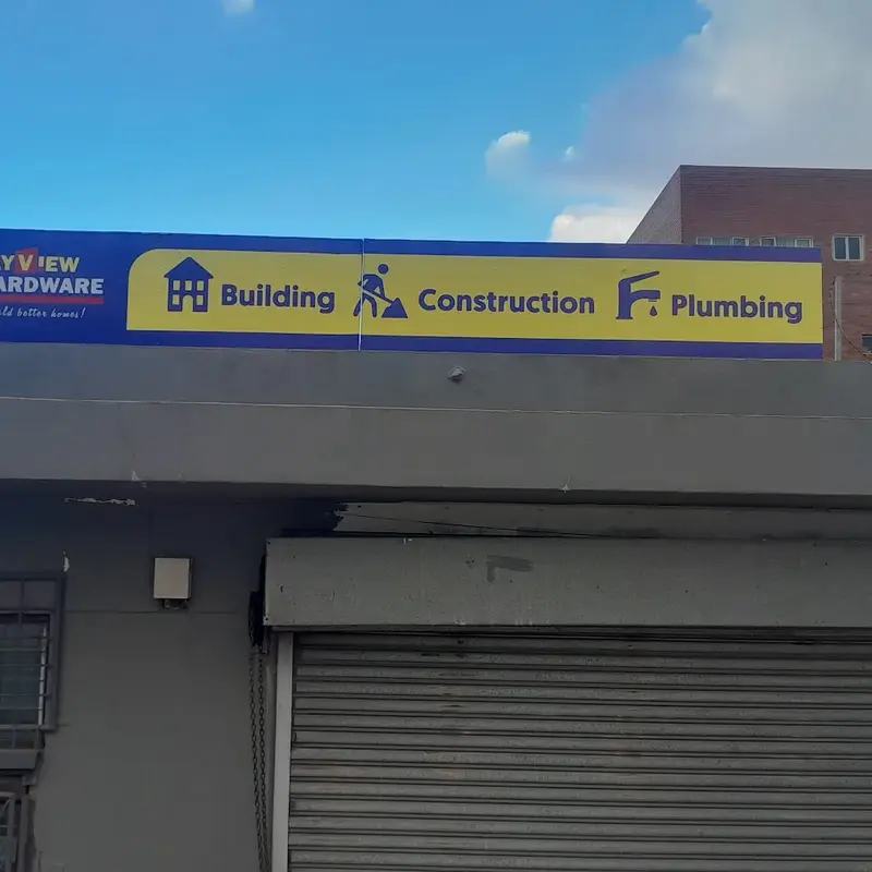 Custom exterior fascia signage featuring contrasting corporate colours and prominent lettering for improved business identification.