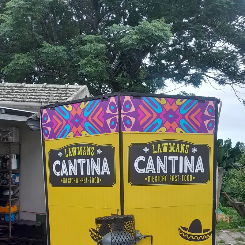 Custom food trailer branding featuring vibrant promotional graphics and playful Mexican-inspired design elements for a memorable business appearance.